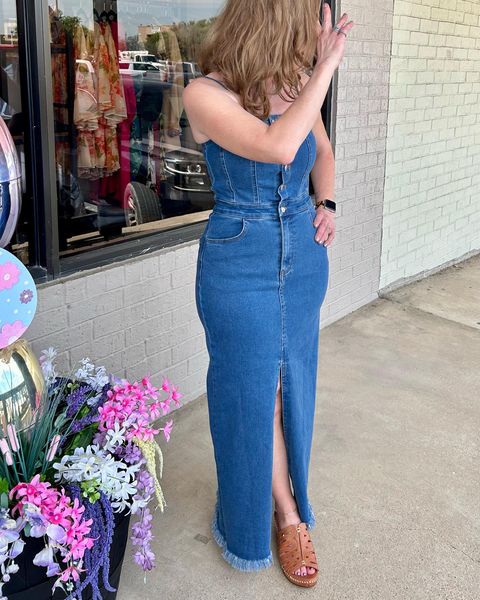 A washed denim midi dress